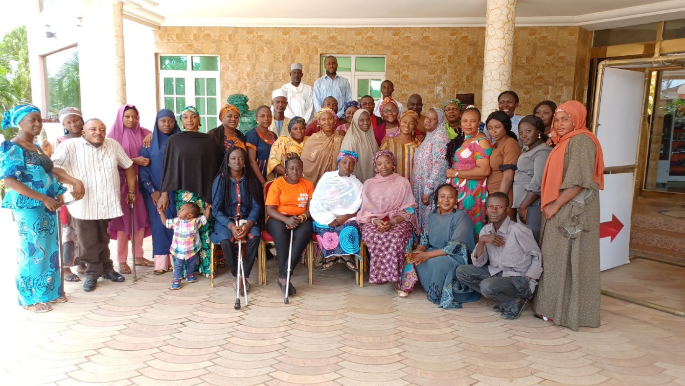 A group of people standing together during a cocreation workshop in Kaduna, Nigeria