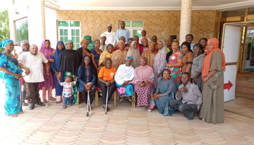 A group of people standing together during a cocreation workshop in Kaduna, Nigeria