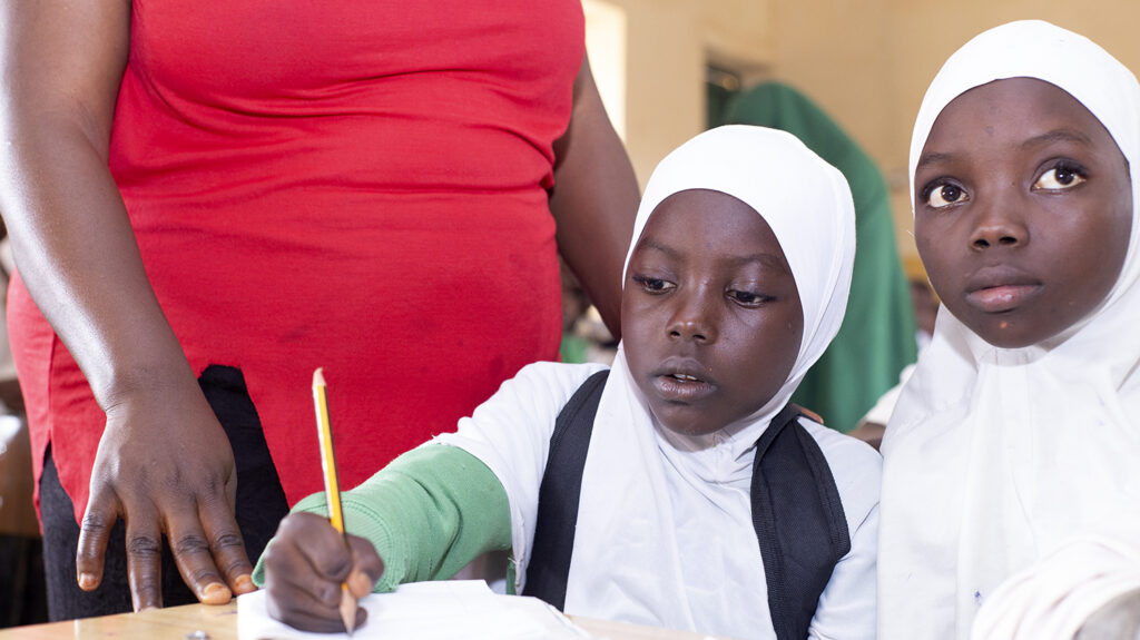 Two female students in Nigeria in the classroom.