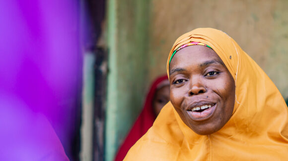 A woman wearing a yellow headscarf in Nigeria.